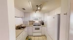 Newer full kitchen, white appliances